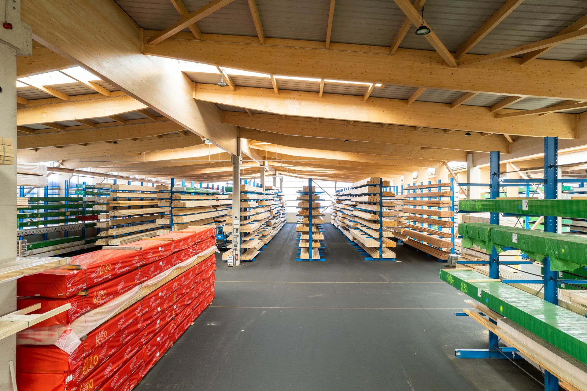 Bright interior of an X-Wood® hall with an exposed timber ceiling